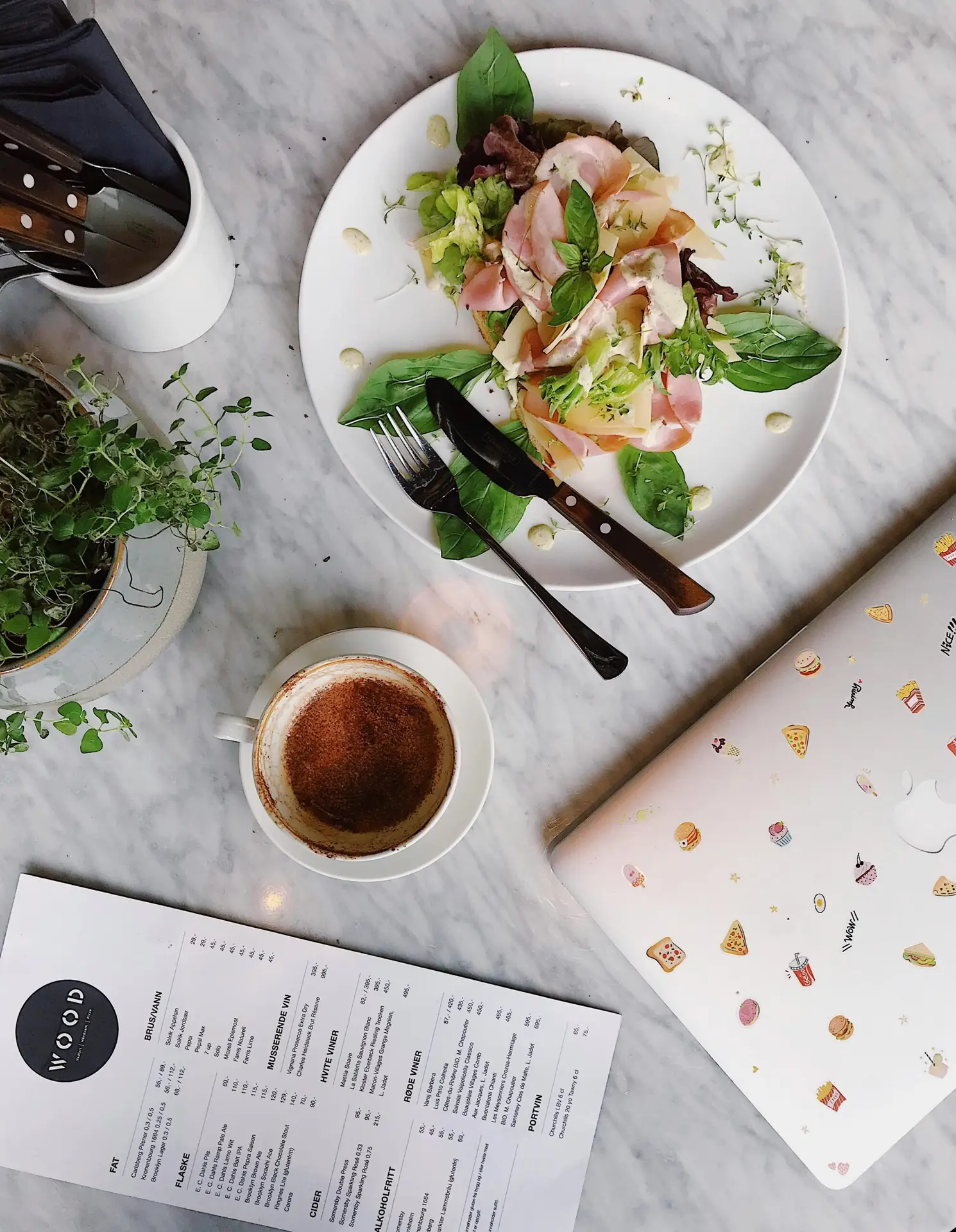 a plate of food and a cup of coffee
